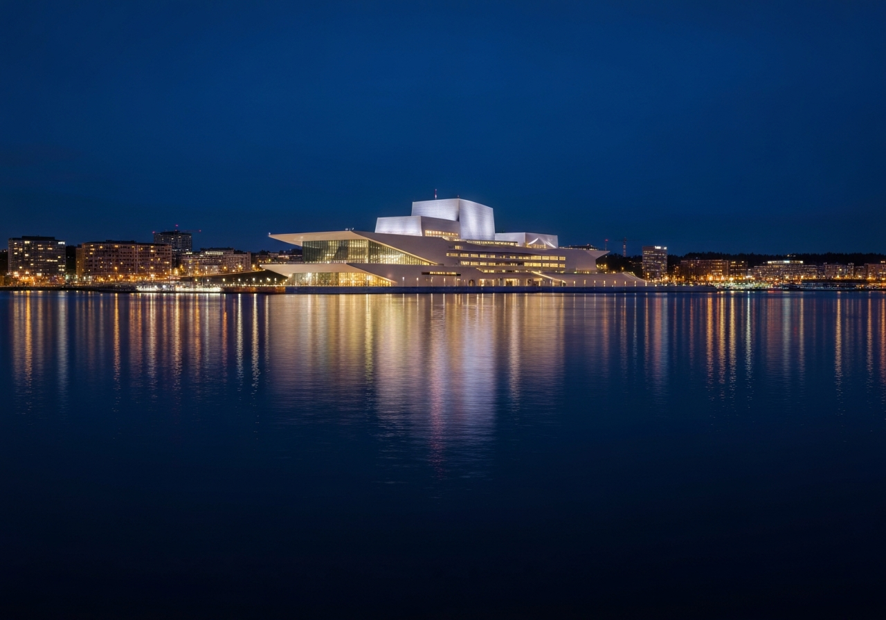 View of Oslo opera house and fjord at night, city lights reflecting in water, modern architecture, dark blue sky, atmospheric
